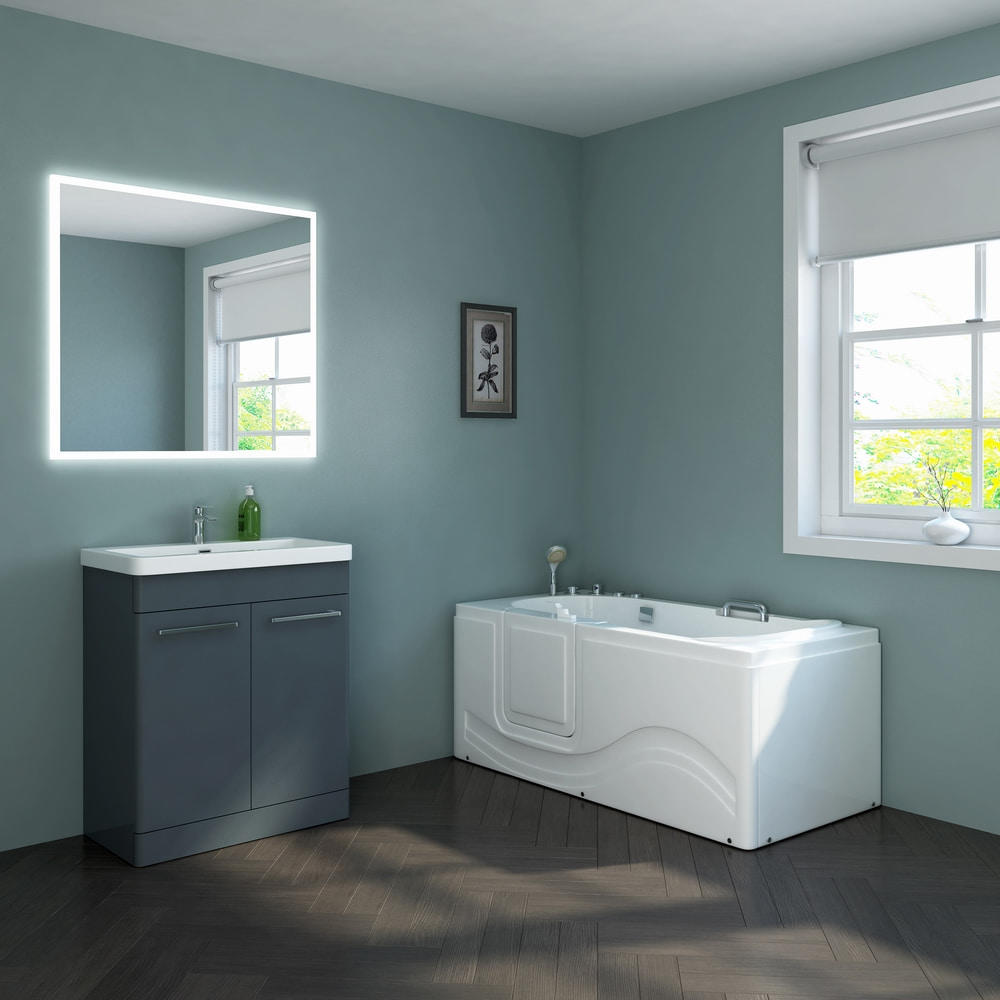What are the key features and benefits of walk-in baths, and how do they address the specific needs of individuals with limited mobility and seniors, making them a valuable addition to the bathroom industry?